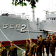 North Korean soldiers watch USS Pueblo, which was seized by North Korean navy off the Korean coast in Jan. 1968, near Taedonggang river in Pyongyang, in this Thursday, June 22, 2006 file photo.